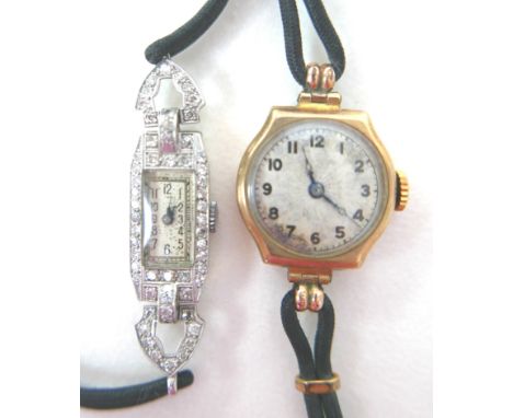 An Art Deco platinum and diamond set lady's cocktail wristwatch, the tank shaped case set with diamonds, silvered rectangular