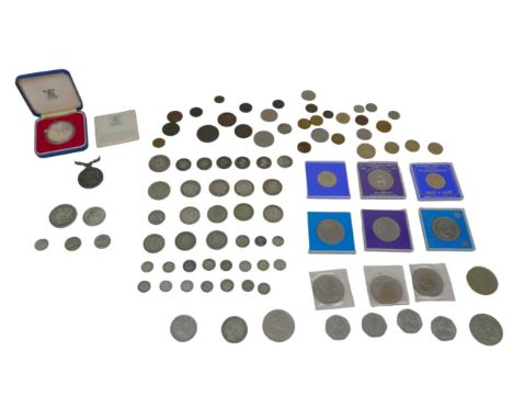 A collection of British and North American coinage, including some George III and other pre-1946 silver coins, including a Ge