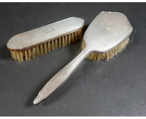 Two silver backed hairbrushes, engine turned decoration , initialled 'G' to their backs, Elkington & Co, Birmingham 1964, 22 
