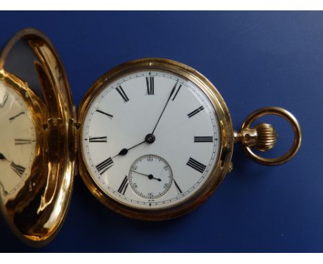 An 18ct gold keyless wind hunter cased pocket watch, having white enamel dial with subsidiary seconds (hairline cracks), foli