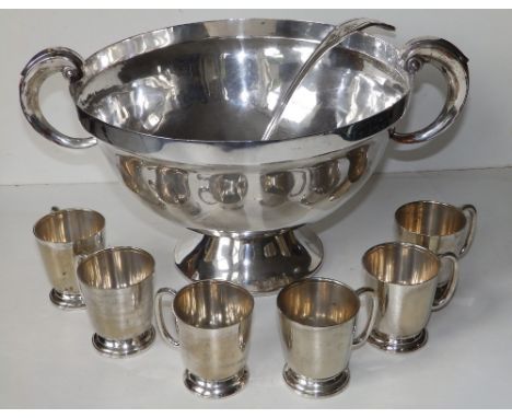 A silver plated punch bowl with six associated cups &amp; ladle. (8)