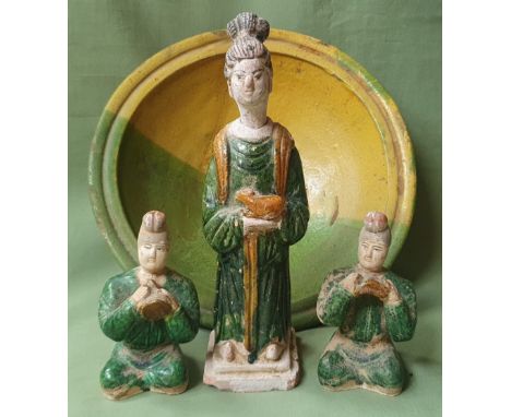 Three Chinese pottery figures and a plate, the tallest figure 9" high. (4)