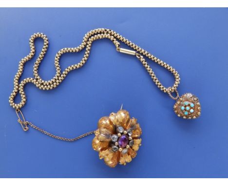 A small Victorian turquoise set yellow metal locket on chain and brooch set with amethyst &amp; paste, 1.5". (2)