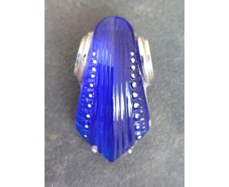A Lalique bleu-de-roi crystal pendant of art deco scroll form mounted on silver with small white enamel beaded detail, 1.25".