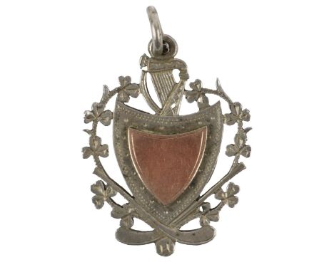 Medal: G.A.A., (Co. Cork) 1932, a shield shaped silver Medal, of pierced design with harp surmounted and shamrock border, the