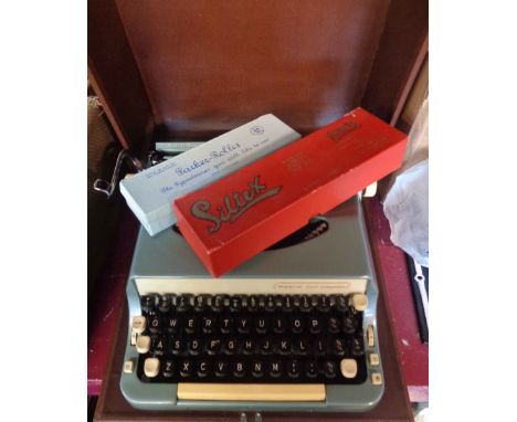 A vintage cased Imperial Good Companion Model 7 typewriter - sold with two boxed cleaning sets