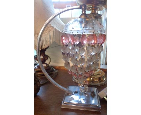 A chrome Art Deco lamp with pink and clear glass drop chandelier style shade