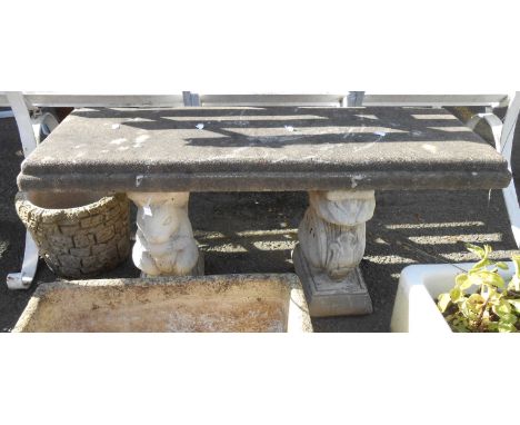 A 1m concrete garden bench, set on squirrel pattern standard ends