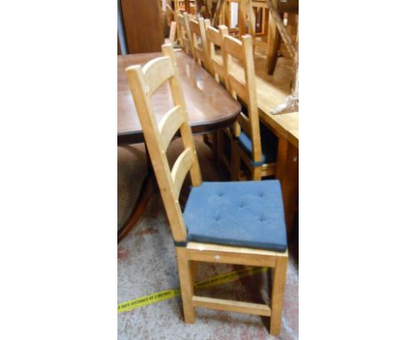 Seven matching modern blonde wood framed ladder back dining chairs - sold with a similar carver chair, all set on simple squa