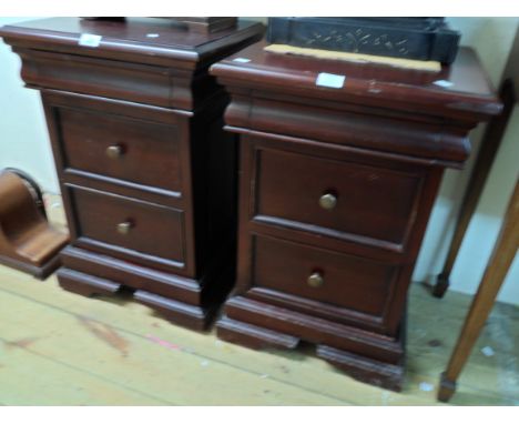 A pair of 46.5cm modern stained wood bedside chests in the Victorian style, each with blind frieze drawer and two drawers und