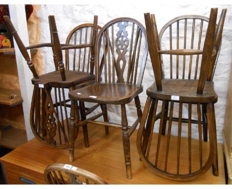 Three similar wheel back kitchen chairs and three similar hoop stick back kitchen chairs, all with moulded solid elm seats