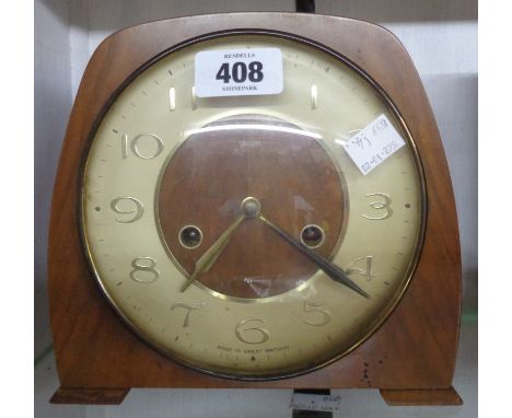 A vintage Smiths walnut cased mantle clock with eight day gong striking movement