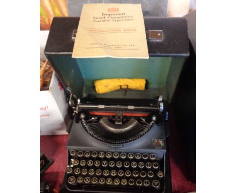 A cased Imperial Good Companion typewriter with instruction book