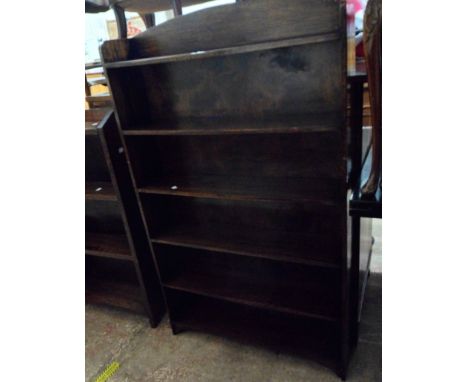 A 76cm 20th Century stained oak six shelf open bookcase, set on bracket feet
