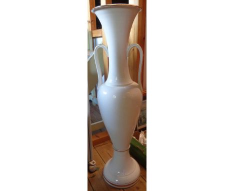 A large white ceramic floor vase with gilt highlighting