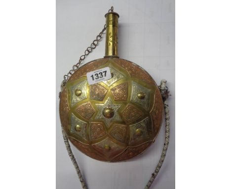 An eastern brass powder flask