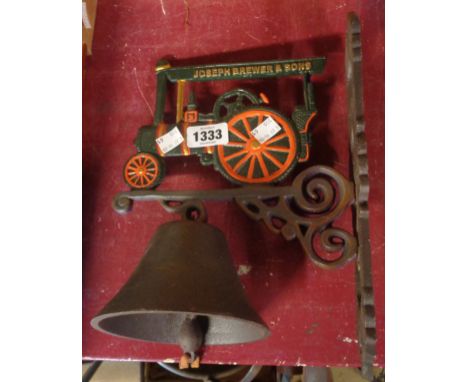 A modern cast iron porch bell with traction engine top