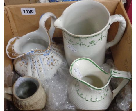 A box of four ceramic jugs