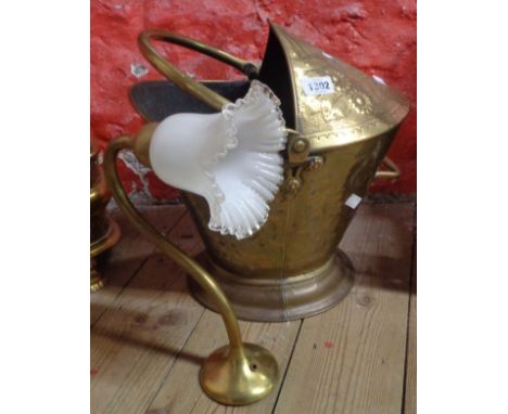 A late 19th Century Aesthetic Movement brass coal scuttle - sold with a lamp with frilled glass shade