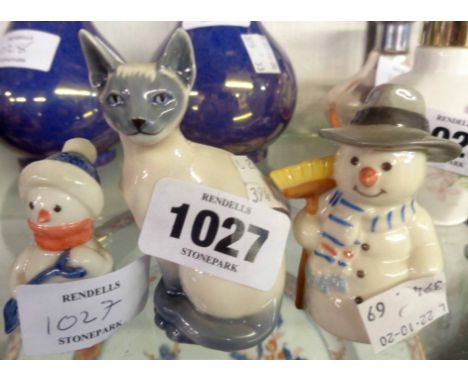 A Royal Copenhagen Mini Collection Siamese cat - sold with two Royal Copenhagen snowmen