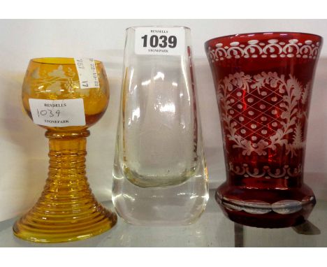 A German ruby flash cut glass beaker, an amber roemer, and a Swedish Karl Skoga engraved vase