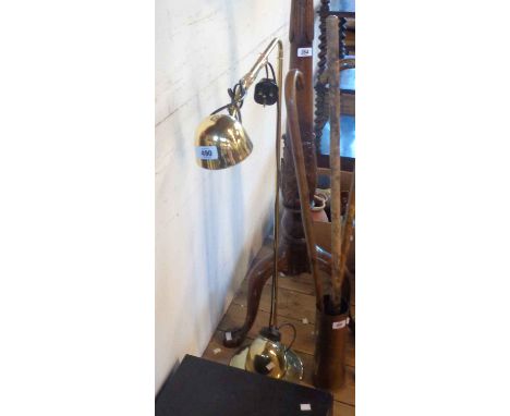 A modern brassed metal floor lamp