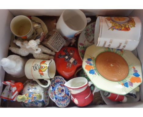 A box containing assorted ceramic items including Clarice Cliff Bizarre Crocus pattern tea plate, commemorative mug with flag