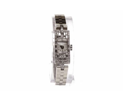 LADY'S ASPREY ART DECO DIAMOND SET MANUAL WIND COCKTAIL WATCHunsigned movement, the rectangular dial visible as a square unde