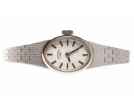 LADY'S NINE CARAT WHITE GOLD ROTARY MANUAL WIND WRIST WATCHthe oval dial with applied baton hour markers, the 14mm case with 