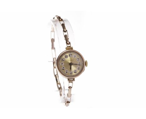 LADY'S TWENTIETH CENTURY ROLEX NINE CARAT GOLD MANUAL WIND WRIST WATCHsigned 15 jewel movement, the round gold dial with Arab