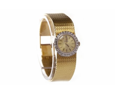 LADY'S OMEGA EIGHTEEN CARAT GOLD DIAMOND SET MANUAL WIND COCKTAIL WATCHsigned 17 jewel movement numbered 30925587, the round 