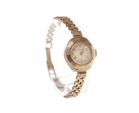 LADY'S NINE CARAT GOLD MANUAL WIND EVERITE WRISTWATCHthe round white dial with applied gold coloured Arabic hour markers, out