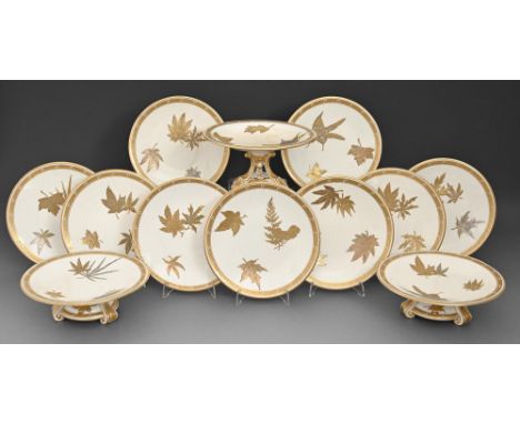 A Royal Worcester bone china Aesthetic Movement style dessert service the raised gilt decoration probably by James and Thomas