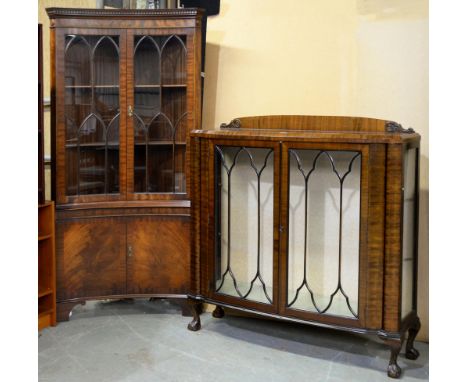 A concave mahogany standing corner cabinet, 20th c, in George III style and a walnut china cabinet, the first 189cm h (2)  Go