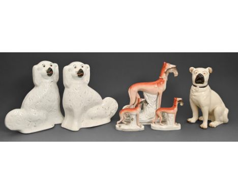 Miscellaneous Staffordshire dogs, first half of 19th c and later, comprising a pug, greyhound, pair of greyhounds, and a pair