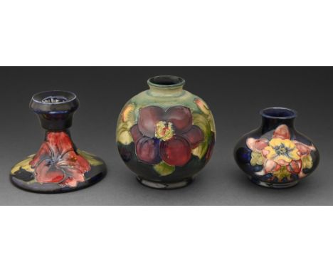 Two Moorcroft Clematis and Columbine vases and a Moorcroft Hibiscus candlestick c.1970, candlestick 9cm h, impressed marks, o