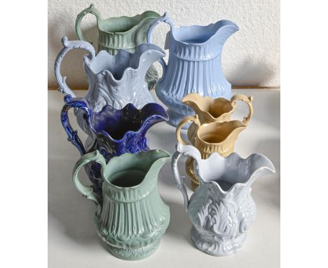 Six Staffordshire smear glazed moulded stoneware jugs and two majolica moulded jugs attributed to Charles Bourne, c.1817-1830