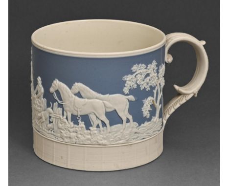 A Staffordshire felspathic stoneware mug, c.1820, sprigged with a hunting scene and engine turned, 10.5cm h  In good conditio
