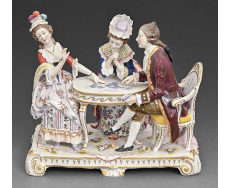 A continental porcelain group of two women and a man around a card table, late 19th c, 21.5cm h, blue underglaze mark  Some m