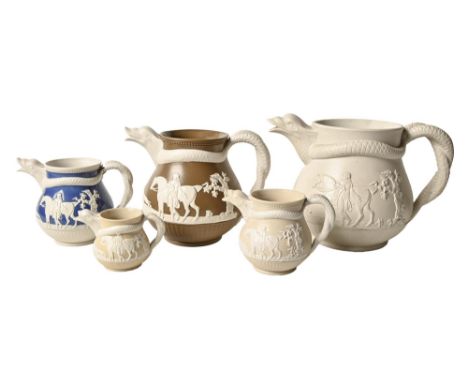 Five Staffordshire smear glazed stoneware jugs with serpent handles attributed to Charles Bourne, c.1817-1830, sprigged with 