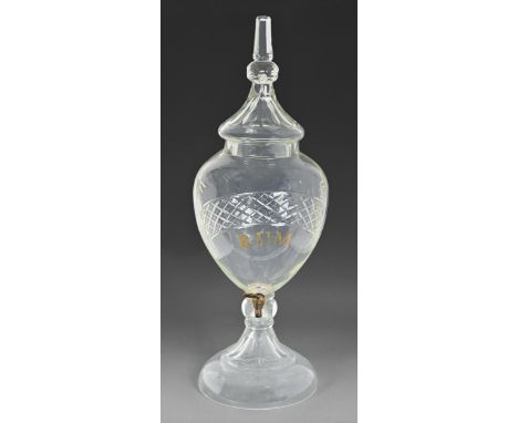 A Victorian publican's shield shaped cut glass spirit fountain and cover, inscribed RUM,&nbsp;78cm h  The spire finial to the