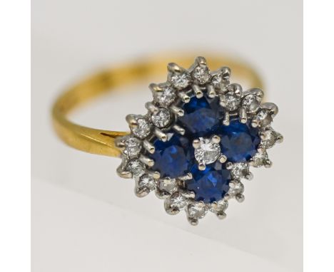 A diamond and sapphire cluster ring set in 18ct yellow gold, size P.