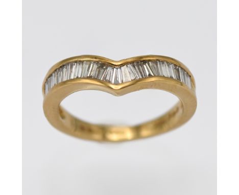 An 18ct yellow gold and baguette cut diamond wishbone ring, marked 1.00 inside, size O.