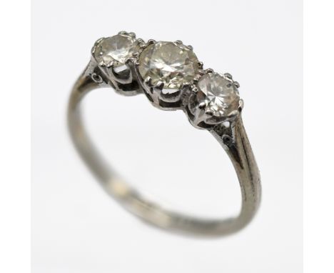 An 18ct white gold and platinum three stone diamond ring, size J/K.