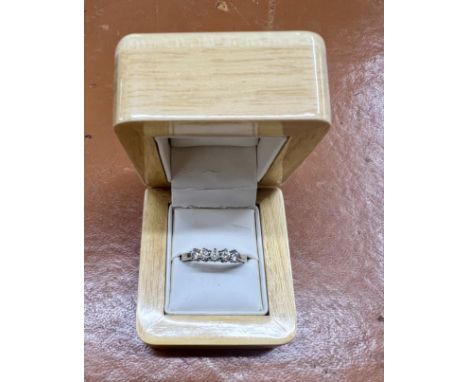 A five stone diamond ring, set in 18ct white gold, size R.
