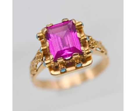 A continental antique gold dress ring set with pink tourmaline and turquoise, stamped on the outside of the band (800), size 