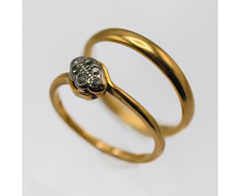 An 18ct yellow gold wedding band ring approx 2.4g together with a 18ct yellow gold diamond ring, approx 2.1g, total weight 4.
