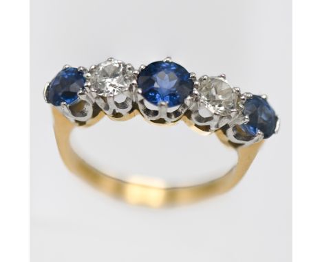 A diamond and sapphire five stone ring, set in 18ct yellow gold, size I/J.