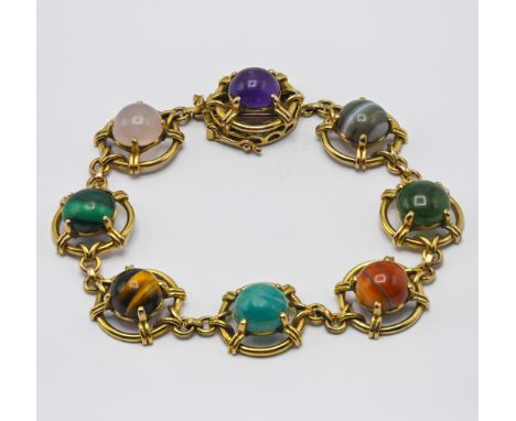 A gold multi gem stone set bracelet, set amethyst, jadeite, rose quartz etc, approx 25.6g, length 21cm.