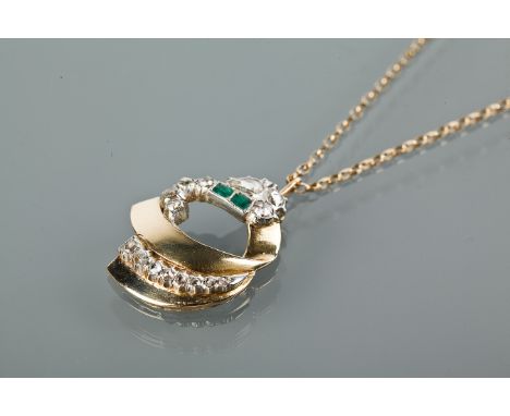 UNUSUAL EMERALD AND DIAMOND SET PENDANT
with irregular cut diamonds and two emeralds, unmarked, tests as gold, on a chain